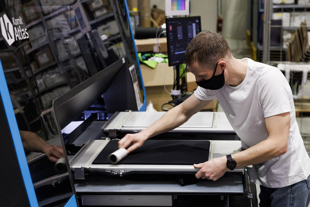 Preparing a garment for direct-to-garment printing on an industrial DTG printer
