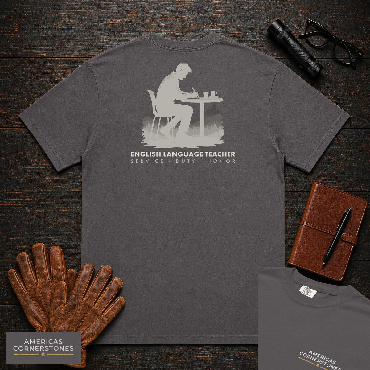 English Language Teacher embroidered t-shirt in Graphite, Marking a page (Male)