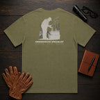 Greenhouse Specialist T-Shirt | Standard Back Print | Inspecting Leaves (Male) — Hemp
