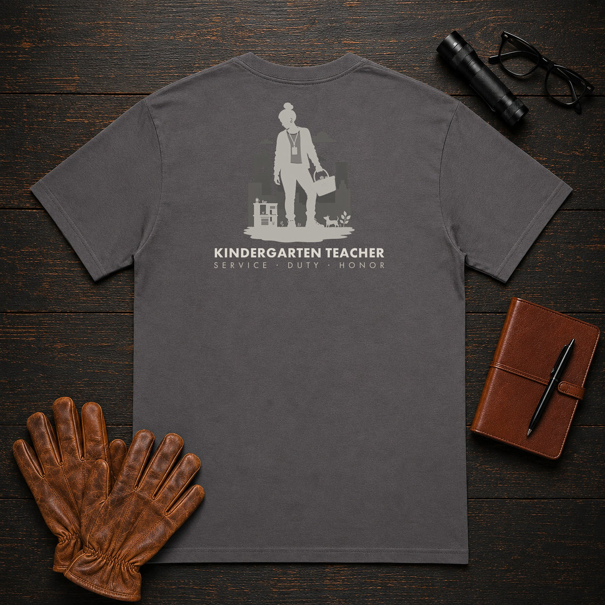 Kindergarten Teacher t-shirt in Graphite, Setting up center (Female)