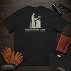 Postal Service Clerk embroidered t-shirt in Black, Weighing a Parcel (Male)