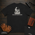 Teacher Assistant embroidered t-shirt in Black, Reading beside desk (Female)